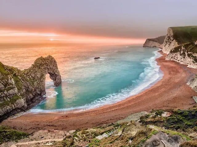 The natural limestone arch of Durdle Door on the Dorset Jurassic Coast