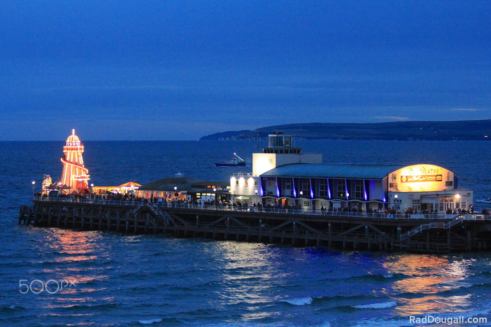 Bournemouth seafront lit up at dusk