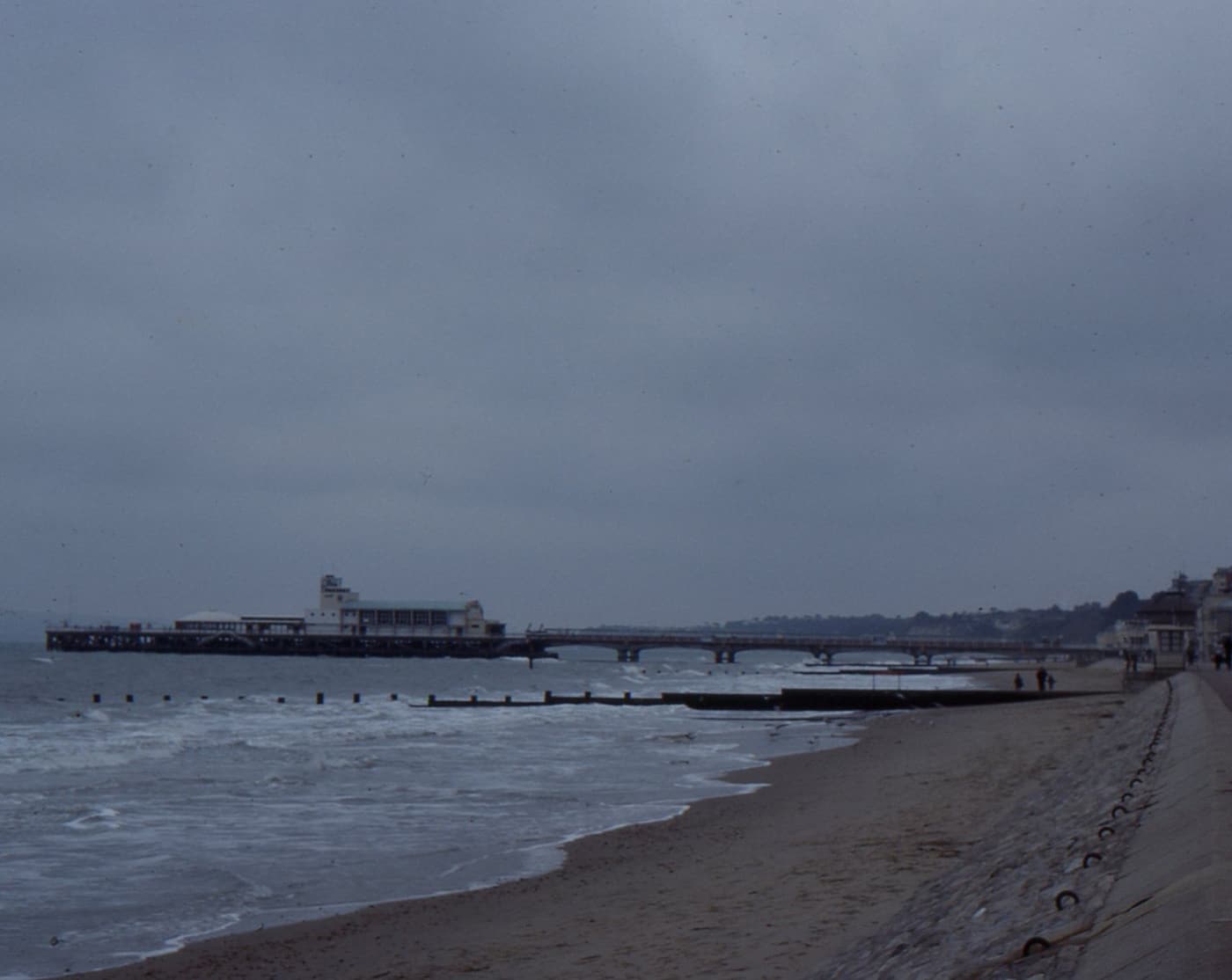 Families on the sandy beach by Bournemouth Pier